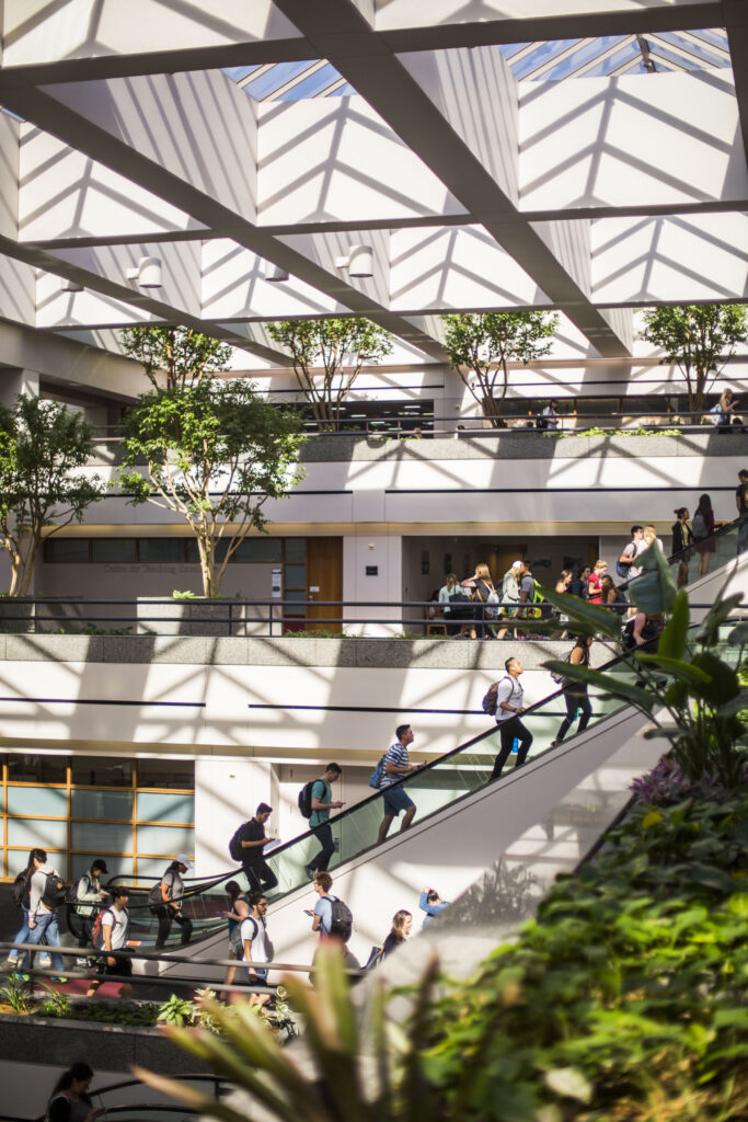 Students Riding the LMU Escalators in University Hall