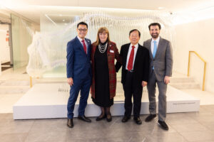 President Poon, Dean Smith, and COO Kiralla at art installation, NYSE