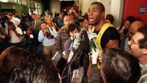Magic Johnson speaks with reporters in LMU Gersten Pavilion following a personal practice January 1996. (Al Seib / Los Angeles Times)