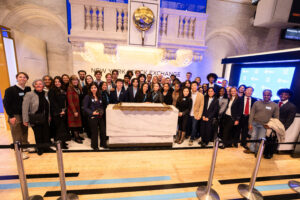 Students and LMU leaders below the trading bell of NYSE