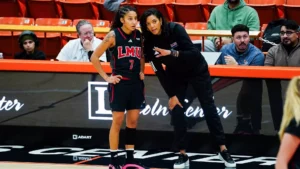 Coach Hughes and 2024-2025 #7 Naudia Evans